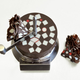 Illustration for article titled Huge chocolate mill reveals delicious changing geometry as you shave it